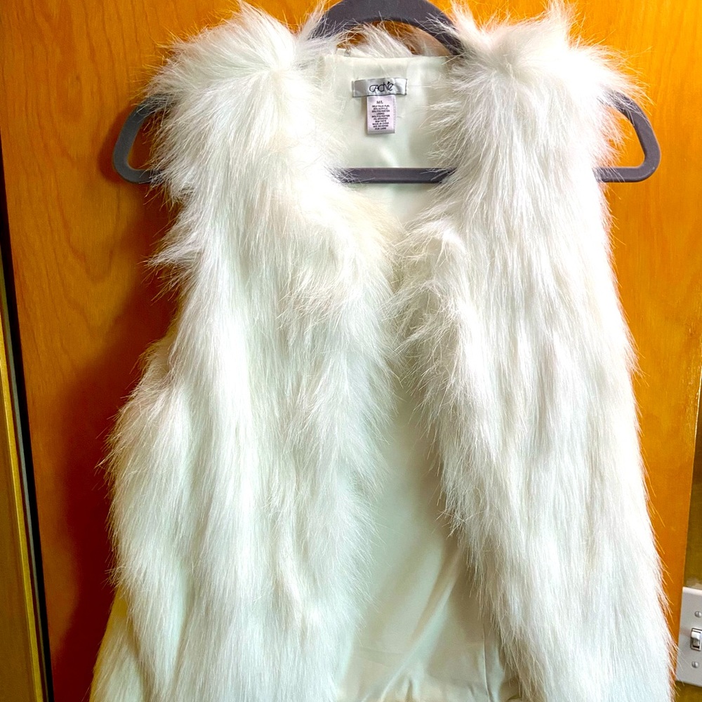 White fur vest